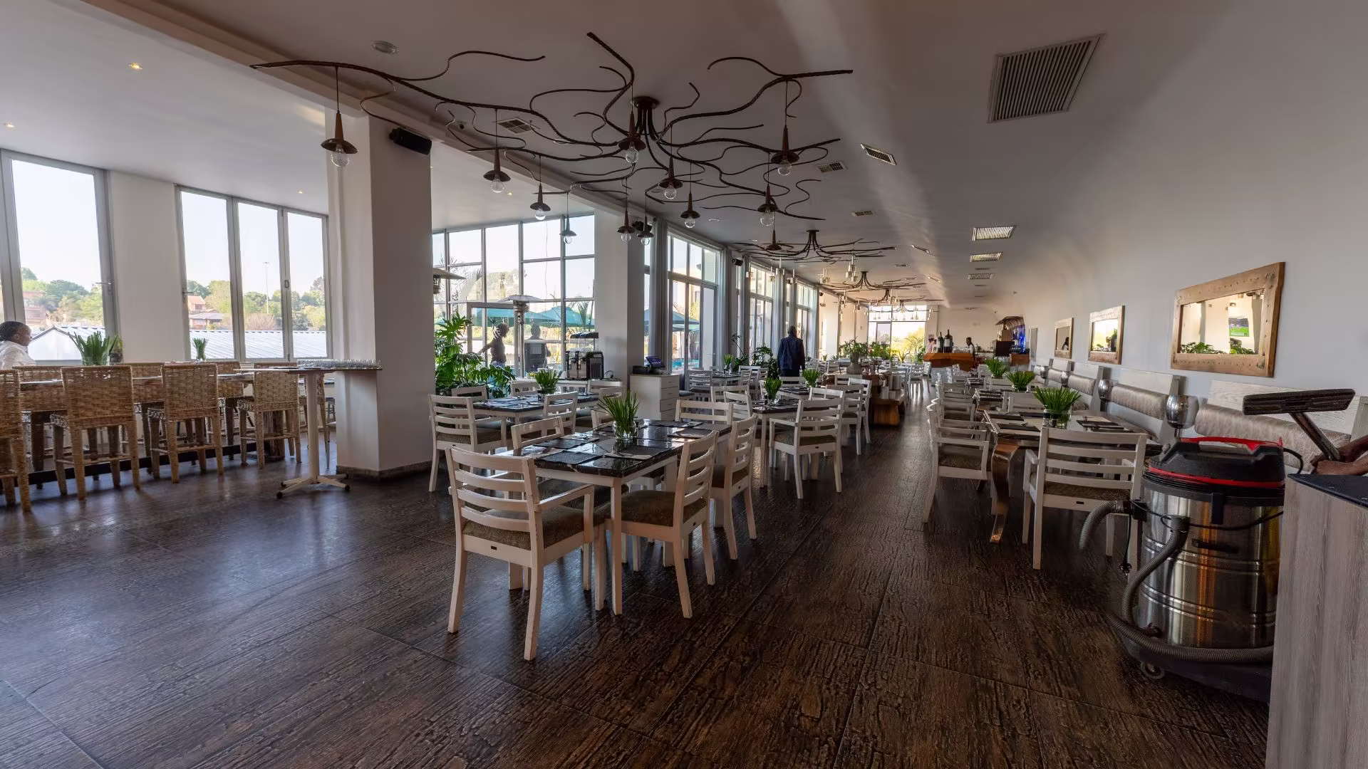 Sculptural pendant lights over the dining hall