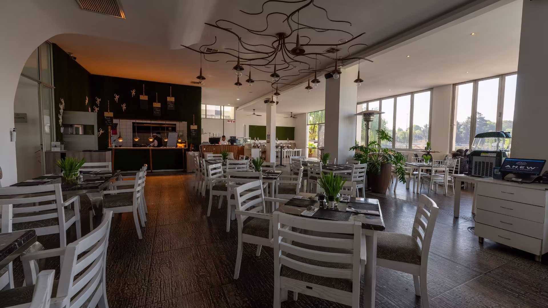 Open pizza kitchen with moss-green wall